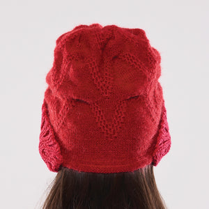 Women's winter Orion Earmuff Hat shown in the colour cardinal.