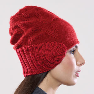 Women's winter Orion Earmuff Hat shown in the colour cardinal.