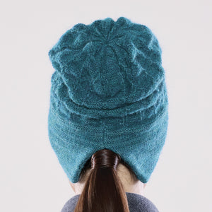 Women's winter Solstice Hat shown in the colour teal.