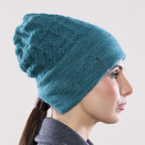 Women's winter Solstice Hat shown in the colour teal.
