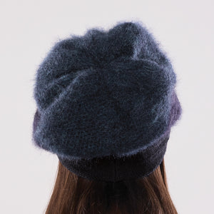 Women's winter Uptown Button Tam shown in the colour ebony to deep ocean.