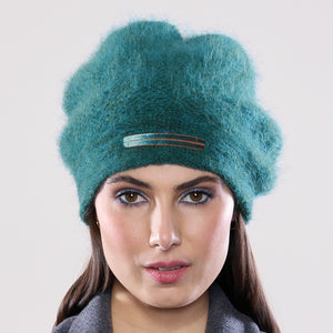 Women's winter Mountaineer Tam shown in the colour viridian.